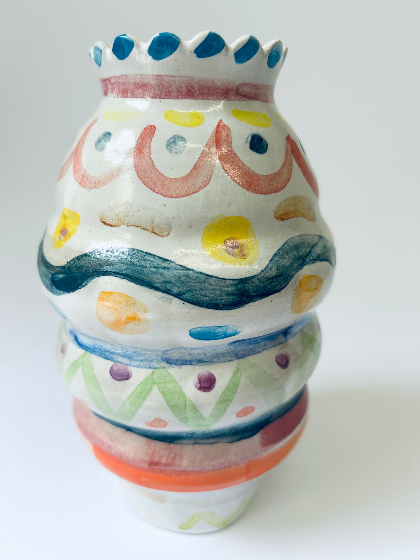 Scalloped edge colourful vase