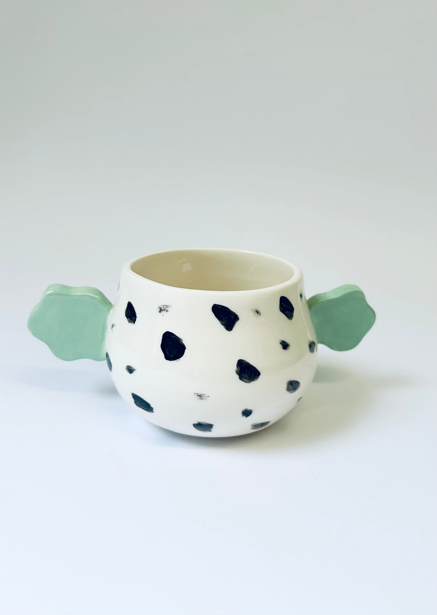 Spotty face pot
