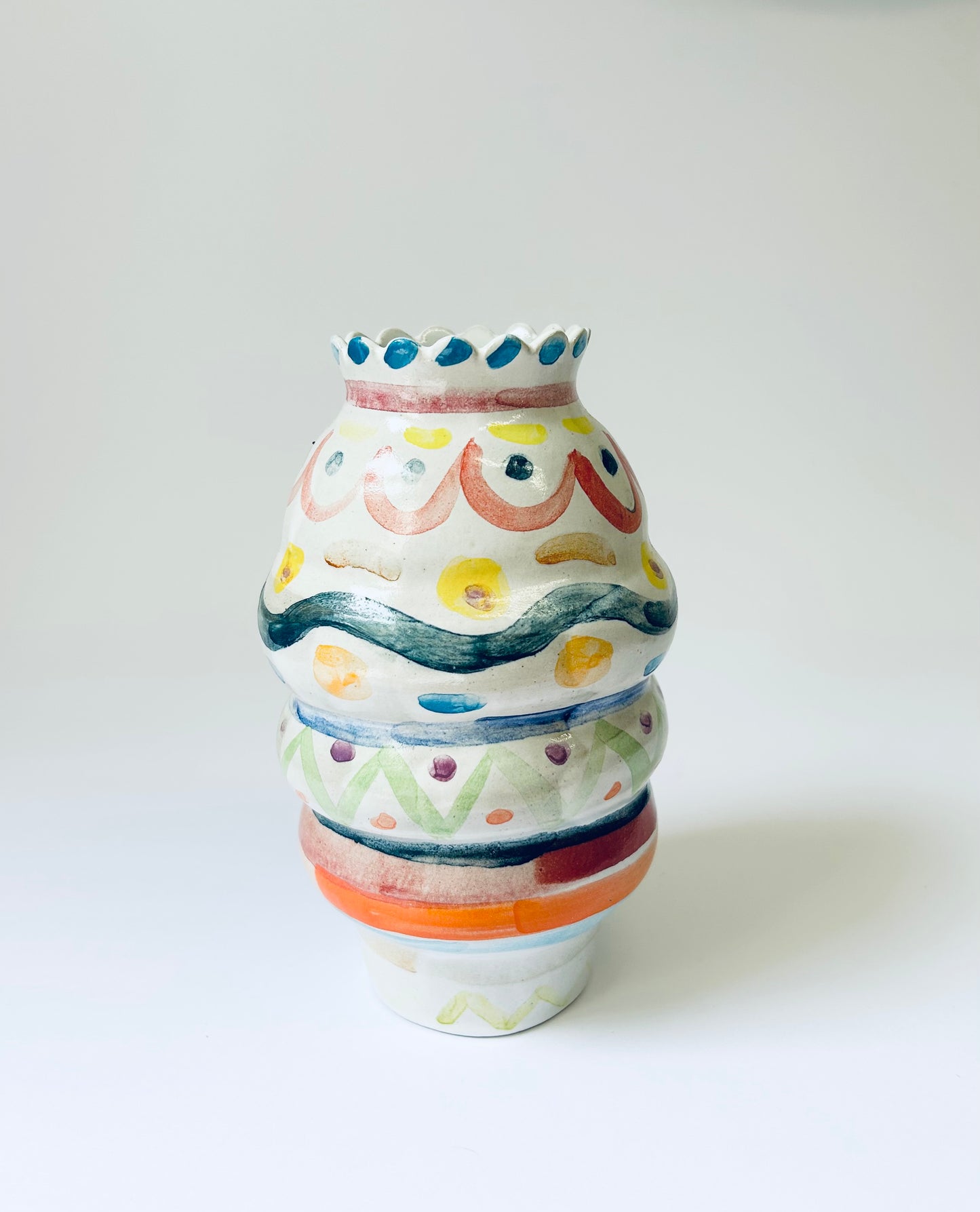 Scalloped edge colourful vase