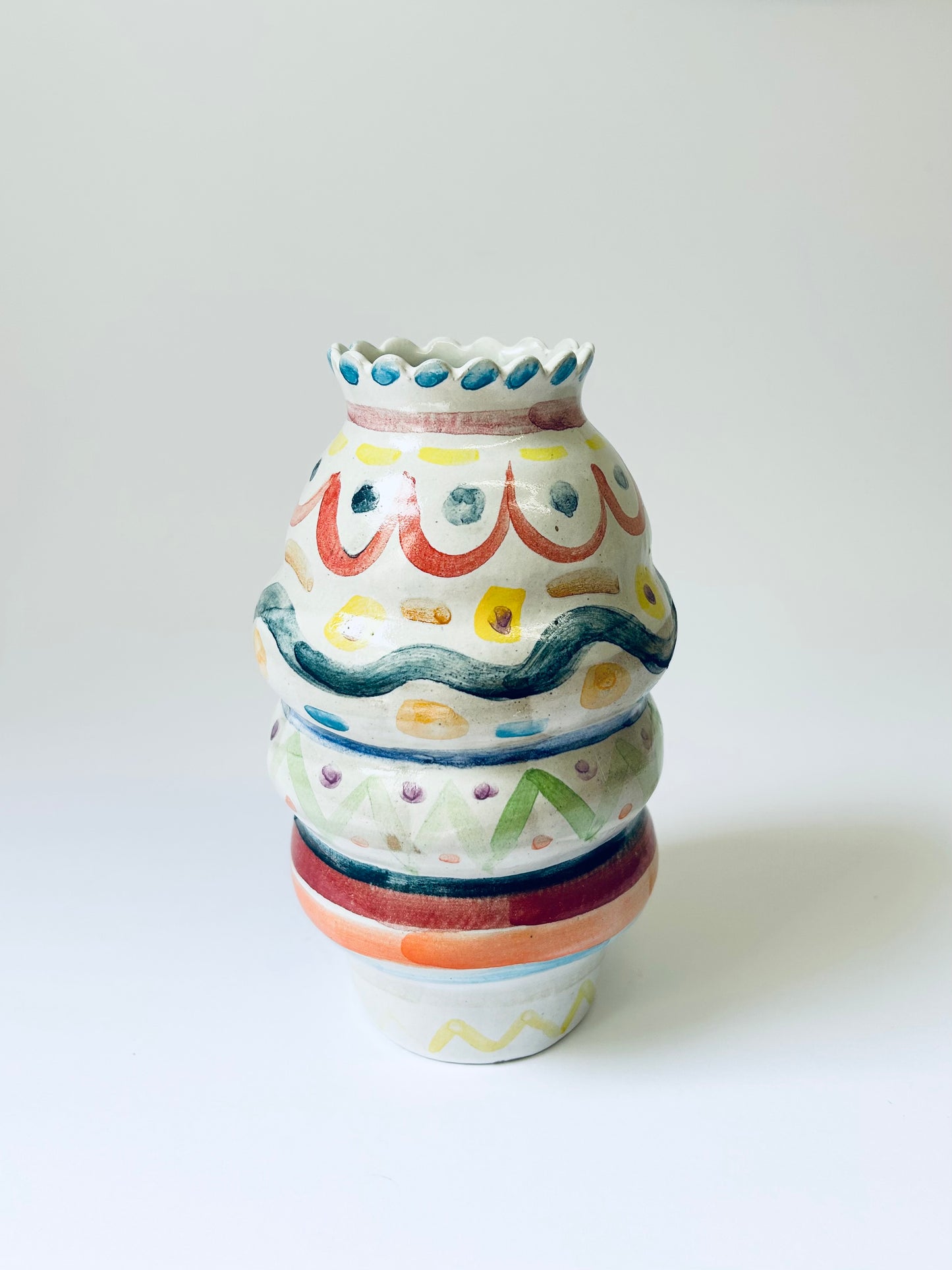 Scalloped edge colourful vase