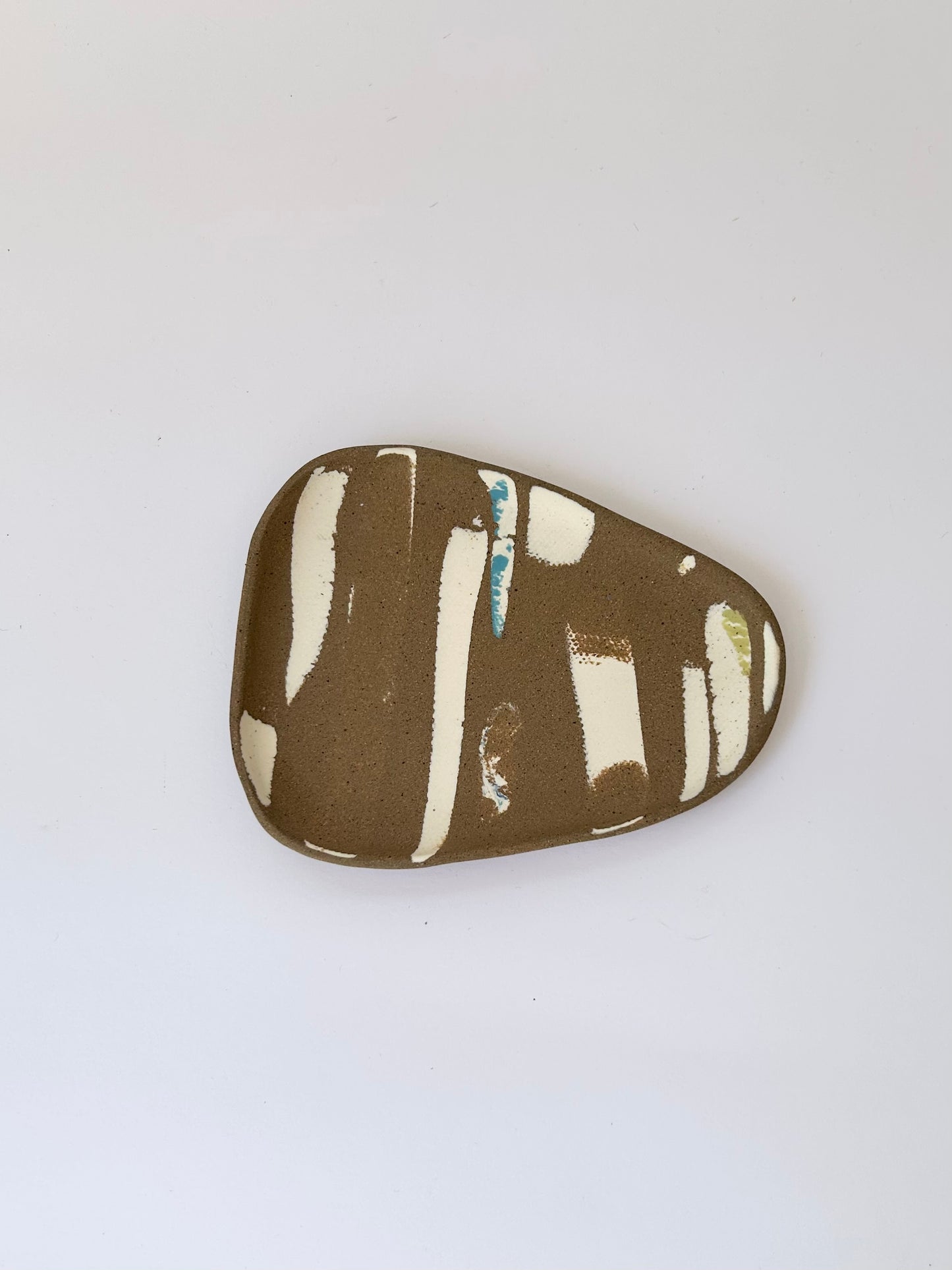 Small brown trinket dish with porcelain details