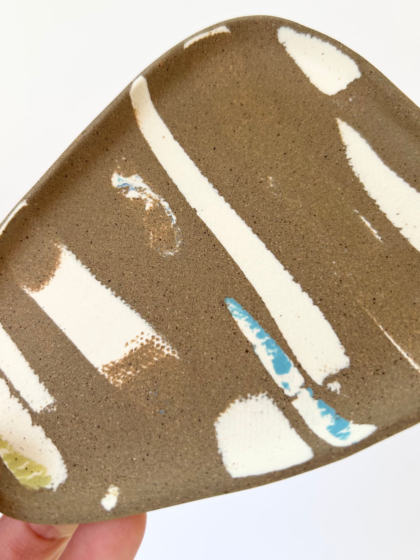 Small brown trinket dish with porcelain details
