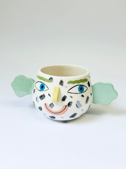 Spotty face pot