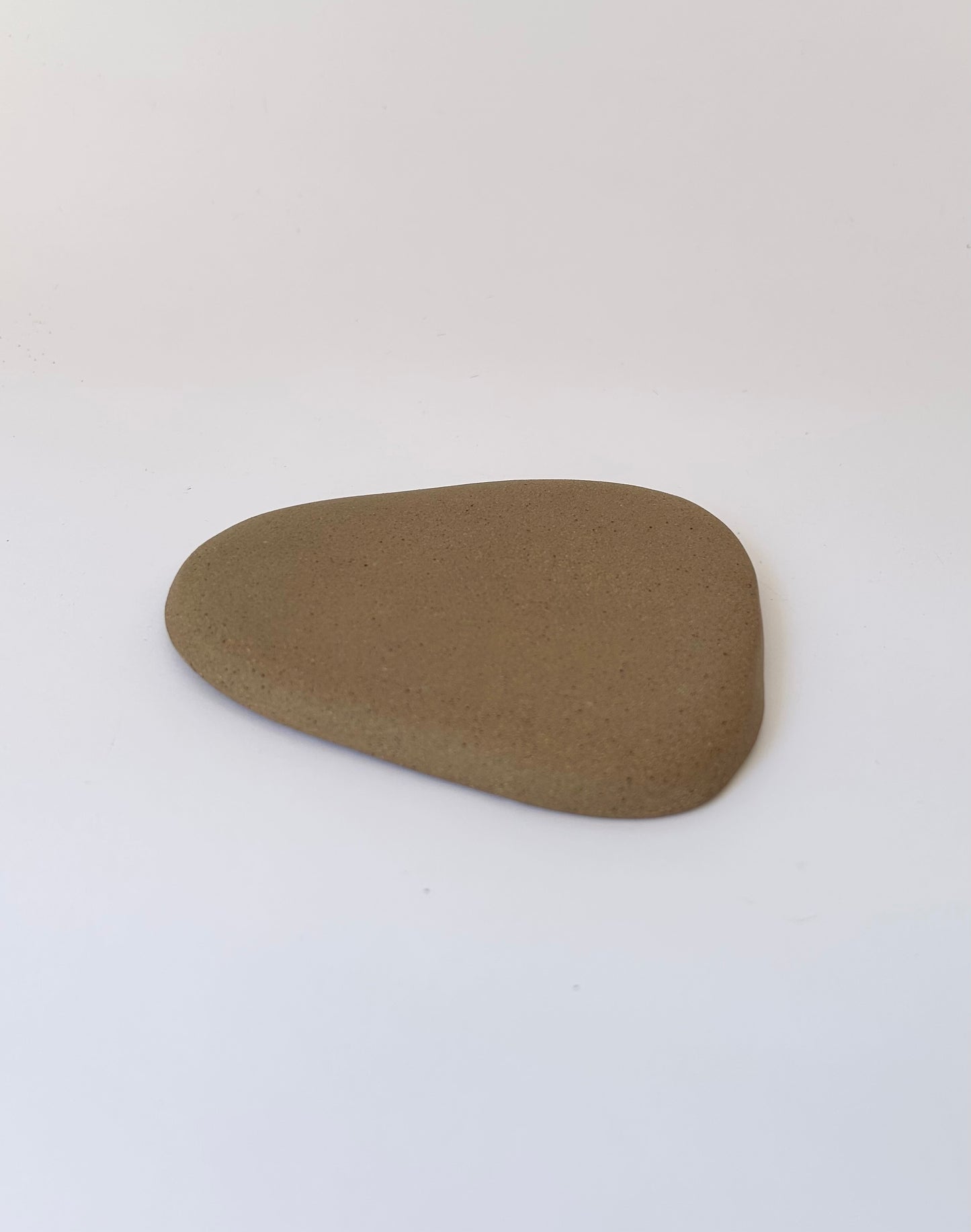 Small brown trinket dish with porcelain details