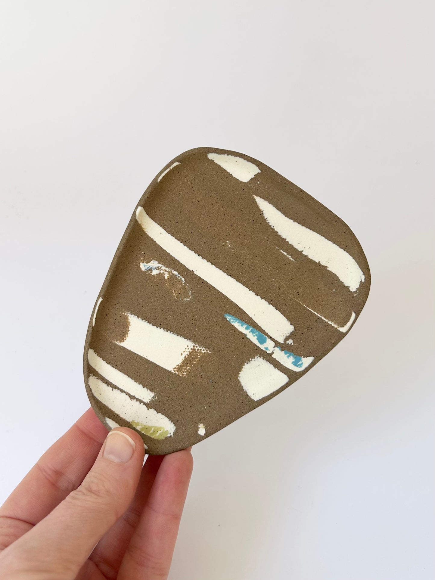 Small brown trinket dish with porcelain details